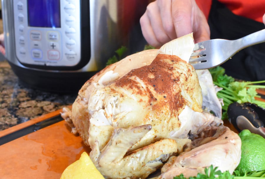 Instant Pot Whole Chicken with fork