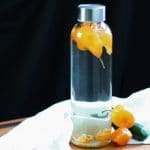 Habanero infused vodka sous vide vertical in jar with peppers