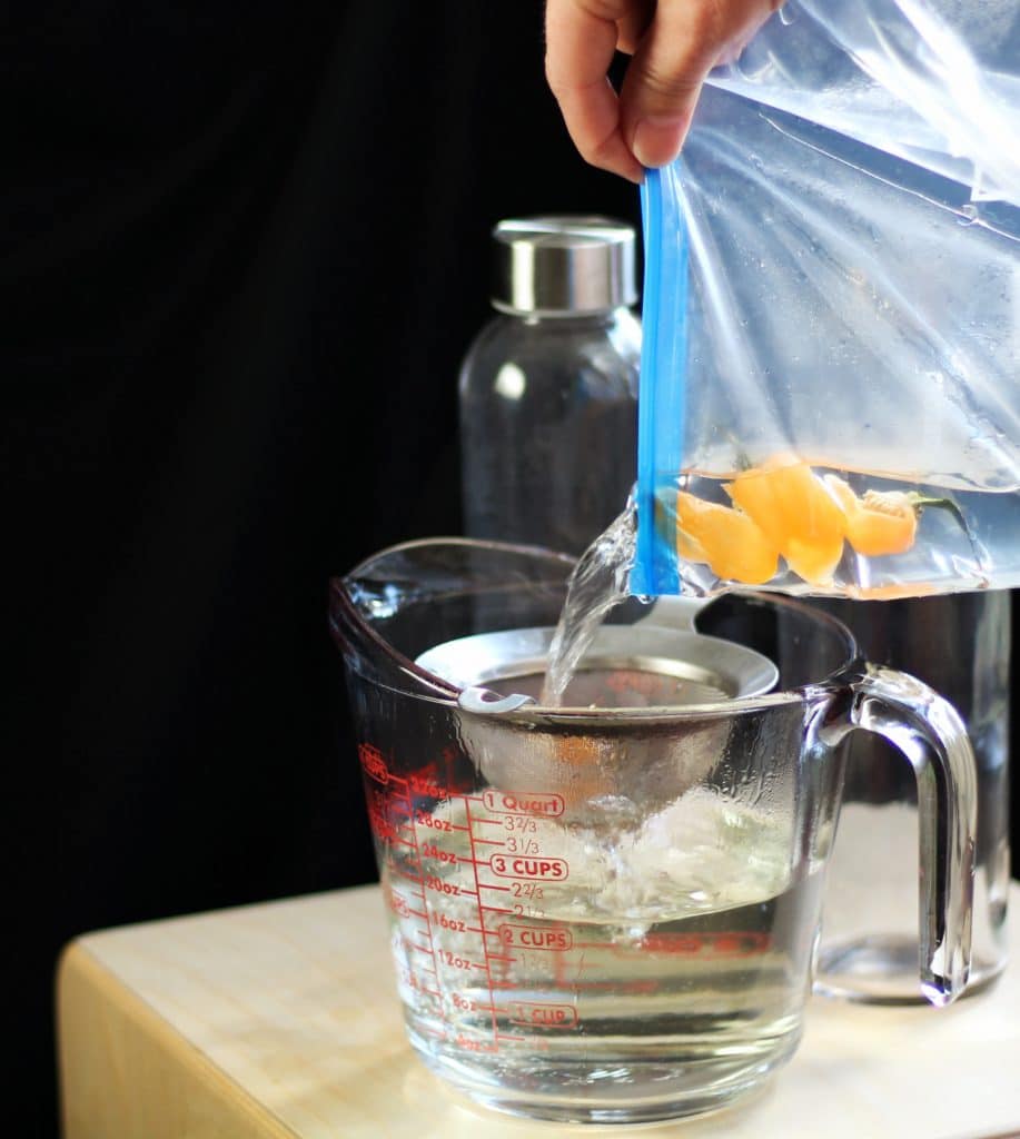 sous vide infused vodka habanero pouring out of bag