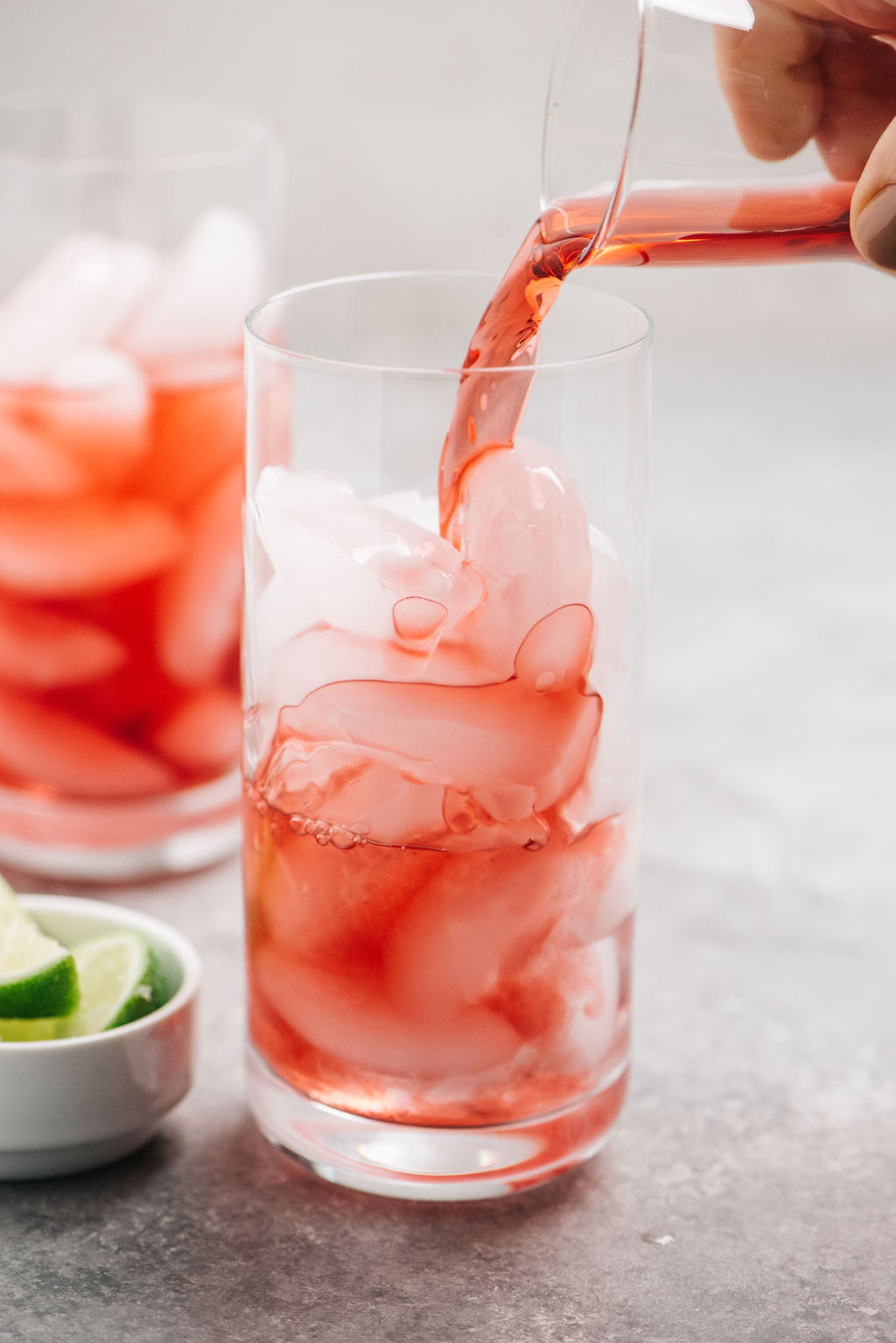 Pouringcranberryjuiceinavodkacranberrydrink The Spicy Apron