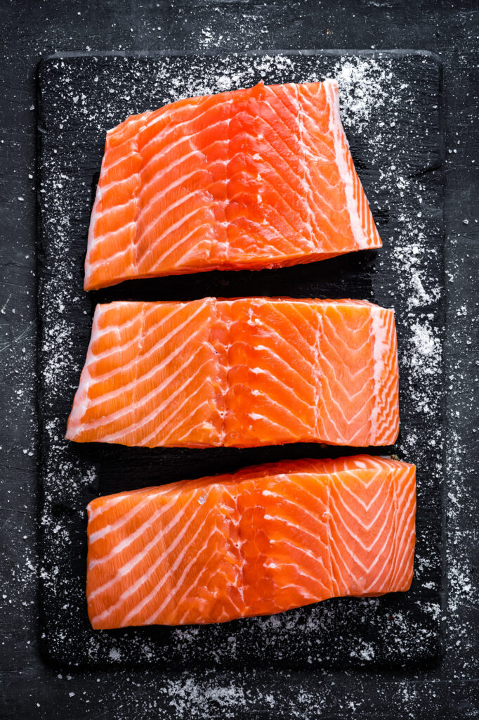 Raw Salmon on a plate vertical